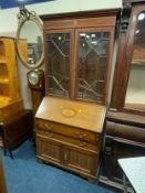 An Edwardian mahogany inlaid bureau bookcase