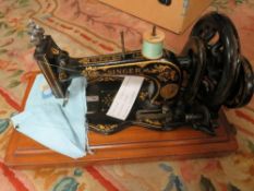 A vintage cased Singer sewing machine