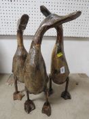 Three lacquered carved wooden ducks