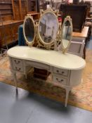 A vintage cream kidney shaped dressing table