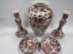 A Toyo ceramic vase, candlesticks and two dishes