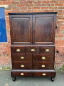 A Georgian mahogany cupboard on chest with an arrangement of nine drawers H 185 cm W 123 cm
