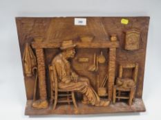 A Black Forest style carved wooden wall plaque