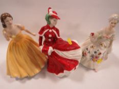 Three Royal Doulton figurines 'Christmas Day', 'Elizabeth' and 'Diana' (3)