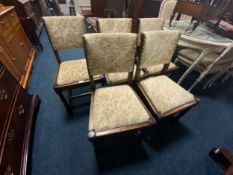 A set of five oak framed upholstered dining chairs