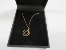 A hallmarked 9 carat gold diamond swirl pendant on chain approx. weight 1.1g