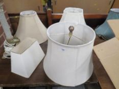 A collection of modern table lamps and shades