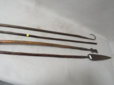 A large 19th century African tribal art Congo spear with leaf shaped head, a tribal staff / bow,