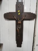 A vintage metal Corpus Christie on wooden cross