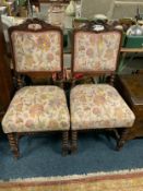 A pair of oak framed upholstered dining chairs with barleytwist legs