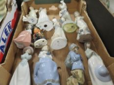 A tray of assorted figurines to include various Nao figures