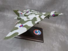 A model of a Vulcan bomber XH558 on display stand, wing span 47 cm