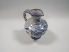 An early Ansbach jug, with plaited handle, signed on base