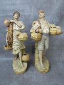 A pair of large terracotta Continental hand painted figures, early 20th century, depicting fishermen