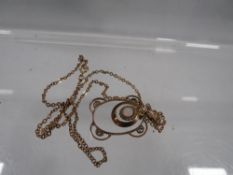 An antique gold pendant set with opal, pendant is marked 9ct