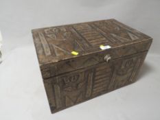 A carved wooden storage box