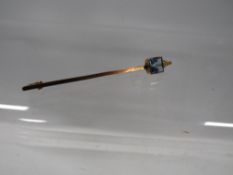 A vintage 9ct stick pin set with an aquamarine style stone approx. weight 1.9g