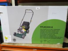 A boxed petrol lawn mower