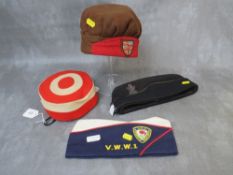 A GUHRKA SIGNALS OFFICER SIDE CAP, along with three various other caps to include a Sandhurst