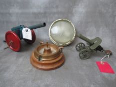 TWO VINTAGE MODLE TOY CANNONS, a trench art ashtray and military light fitting with etched glass