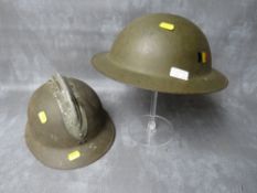 A FRENCH ADRIAN TYPE HELMET SHELL, plus a 1950s Belgian type tin helmet (2)