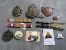 A QUANTITY OF MISCELLANEOUS BADGES, to include Australia R.A.F. cap and w prop badges, a Victorian