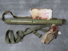 A WW2 GERMAN MG42 SPARE BARREL CARRY CASE, a small enamel sign A/F, an SMG sling and a set of