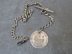 A SILVER POCKET WATCH CHAIN WITH FOB MADE FROM PERSIAN COIN, inscribed H. Procter DC7 North Staffs