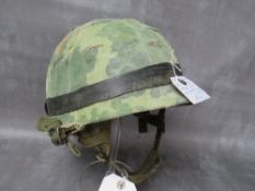 A US WW2 M1 HELMET (FRONT SEAM), with 1961 Air Borne liner, with camo cover