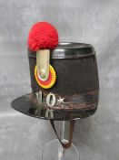 AN EARLY 20TH CENTURY BELGIAN SHAKO, badged 10