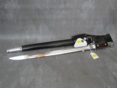 A NICKEL-PLATED PARADE BAYONET, in scabbard with frog
