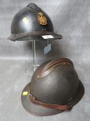 AN ADRIAN TYPE HELMET, badged for Belgian Civil Defence, with black painted surfaces, together