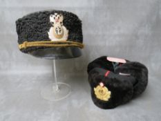 A COLD WAR ERA RUSSIAN NAVY LEATHER USHANKA HAT, along with a later example (2)