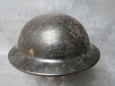 A BRITISH WW2 'PLASFORT' HELMET, faintly marked ARP to the underside of the rim