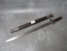 A BRITISH 1907 PATTERN BAYONET, with issue mark 3 18, with plain wooden grip, makers mark for