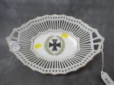 A GERMAN WWI PORCELAIN BASKET, the centre decorated with an iron cross medal in wreath