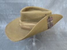 A WW2 SLOUCH HAT WITH ROYAL SIGNALS BADGE