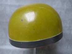 A VINTAGE MOTORCYCLE HELMET, finished in olive green