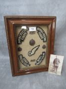 A ROYAL FLYING CORPS BADGE COLLECTION IN FRAME, to include shoulder titles, cap and collar badges