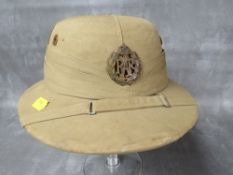 BRITISH WW2 R.A.F. PITH HELMET, badges to front, retailers label for G.C. Desa & Co.
