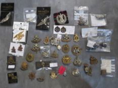 A COLLECTION OF MILITARY CAP AND OTHER BADGES, to include Lancers, RA, South Staffs, US types etc.