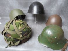 A COLLECTION OF TIN HELMETS, to include WW2 Bulgarian type French Paras and a copy WW2 Japanese type