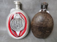 A WW2 GERMAN OAK WATER BOTTLE DATED 1942, hand carved decoration i German / Danish, along with a