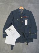 AN R.A.F. OFFICERS TUNIC, with brass Queens crown buttons, medal ribbons to breast, including one