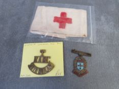 A WWI RED CROSS ARMBAND, a Territorial Royal Army Medical Corps, South Midland title and a Queens