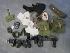 A BOX OF MILITARY AND POLICE STRAPS, BELTS POUCHES ETC.