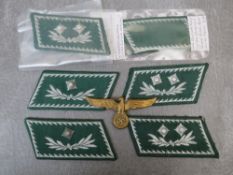 A COLLECTION OF GERMAN CUSTOMS OFFICERS COLLAR PATCHES, and a brass breast / cap eagle