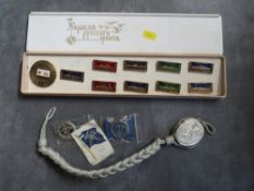 TWO FINNISH CUSTOMS WHITE METAL LONG SERVICE BADGE, a post war German marksman lanyard and a boxed