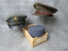A BOXED VINTAGE W.R.A.F CAP, along with two US army peaked caps (3)