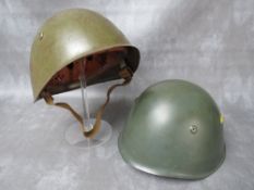 TWO ITALIAN WW2 TYPE GREEN PAINTED TIN HELMETS, with leather liners (2)